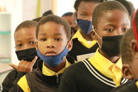 South African children lining up with masks on